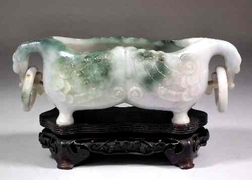 Appraisal: A Chinese green and white jadeite two-handled vessel the lobed