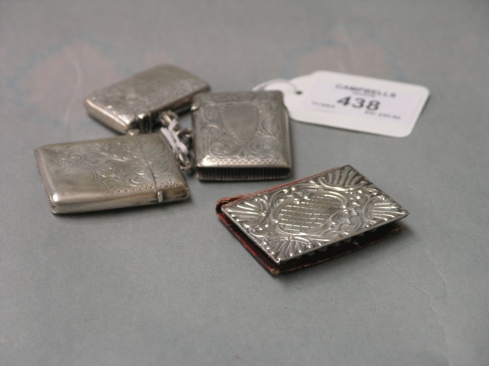 Appraisal: Three engraved silver vesta cases and a silver mounted needle