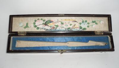 Appraisal: A Japanese lacquer fan box with painted silk lined lid