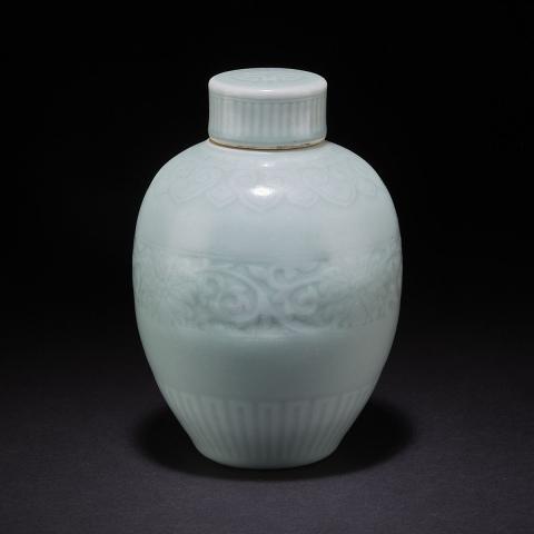 Appraisal: A Celadon-Glazed Covered Jar Qianlong Mark Of ovoid form decorated