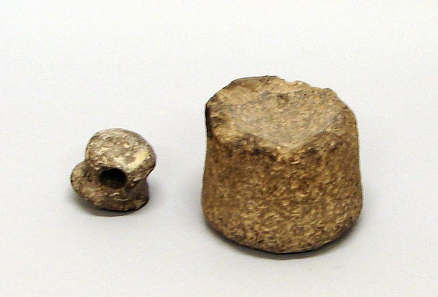 Appraisal: Grinding stone measuring x with small x holed pestle bearing