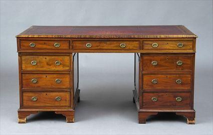 Appraisal: REGENCY MAHOGANY PEDESTAL DESK The rectangular leather-inset top above three