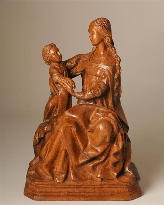 Appraisal: A Continental Carved Oak Sculpture of a mother and child