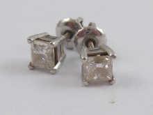 Appraisal: A pair of white metal tests high carat gold square