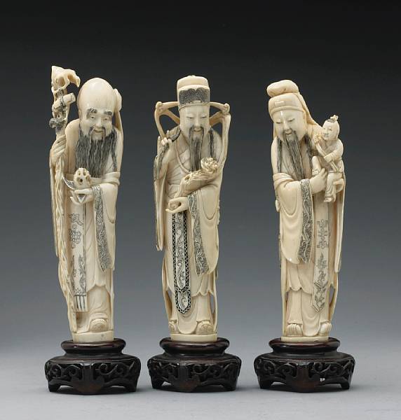 Appraisal: A tinted ivory set of the 'Three Stars of Happiness'