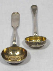 Appraisal: A Russian silver sifter spoon halmarked St Petersburg together with