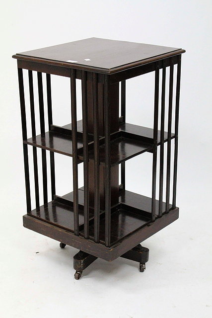 Appraisal: AN EDWARDIAN MAHOGANY REVOLVING BOOKCASE with open sides