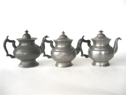 Appraisal: Three pewter teapots boardman hart new york Each with a