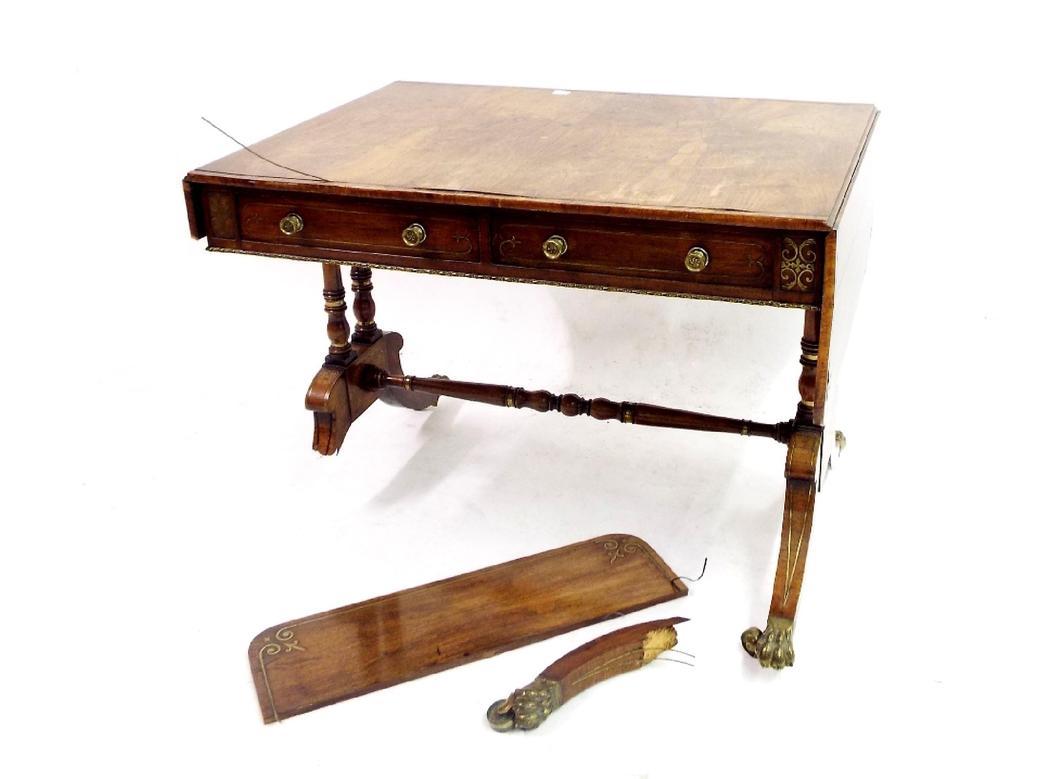 Appraisal: Attractive Regency rosewood and brass inlaid sofa table fitted with