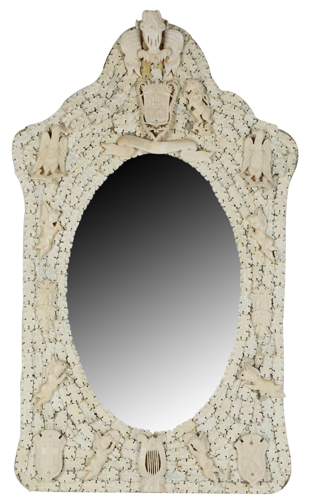 Appraisal: EUROPEAN CARVED BONE WALL MIRRORthe oval beveled plate within an