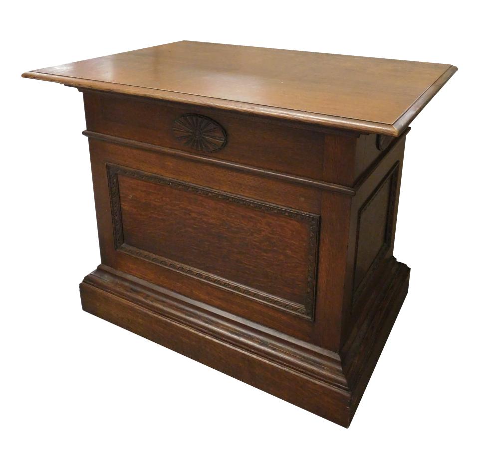 Appraisal: Oblong oak stand with paneled sides and stepped molding base