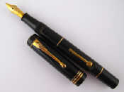 Appraisal: A Burnham fountain pen in black side lever tear drop