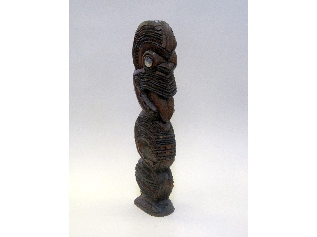 Appraisal: Carved wooden Maori figure with mother of pearl inset eyes