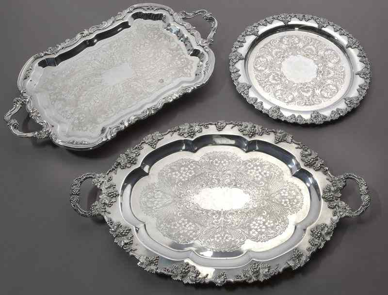 Appraisal: Silver repousse and etched trays including with a scrolled border