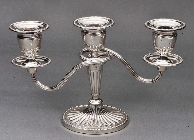 Appraisal: A SILVER THREE BRANCH CANDELABRA on oval loaded base with