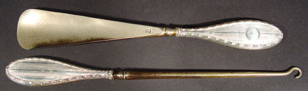 Appraisal: Silver handled boot pull and shoehorn each with engine turned