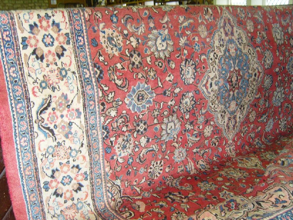 Appraisal: A heavy wool carpet in a Persian design with pale