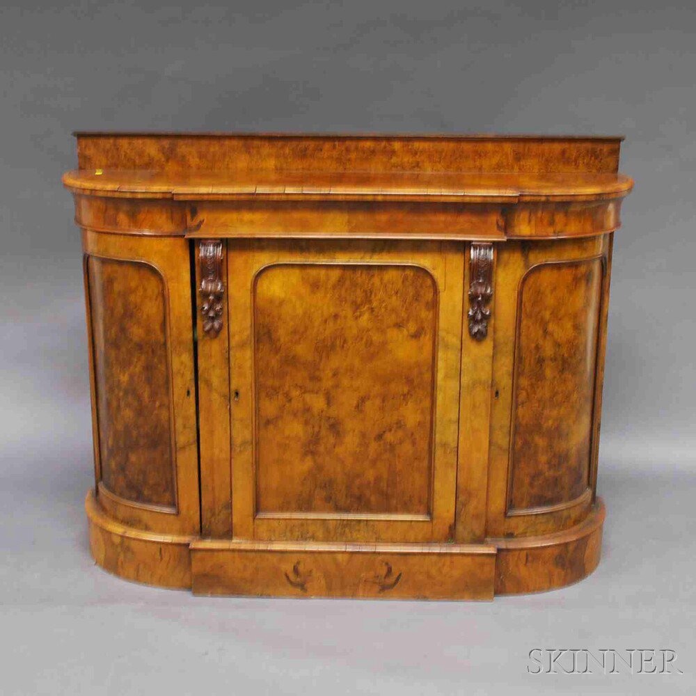 Appraisal: Continental Walnut Veneer Credenza with a rectangular backsplat on the