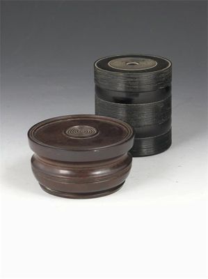 Appraisal: A th century turned ebony jar and cover with reeded