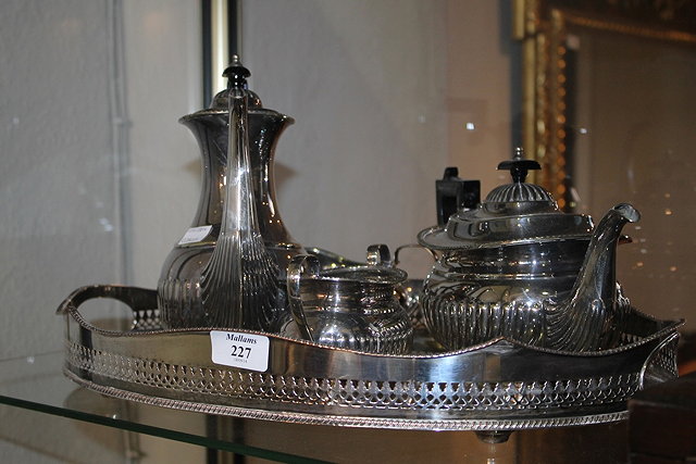 Appraisal: A SILVER PLATED FOUR PIECE TEA AND COFFEE SERVICE comprising