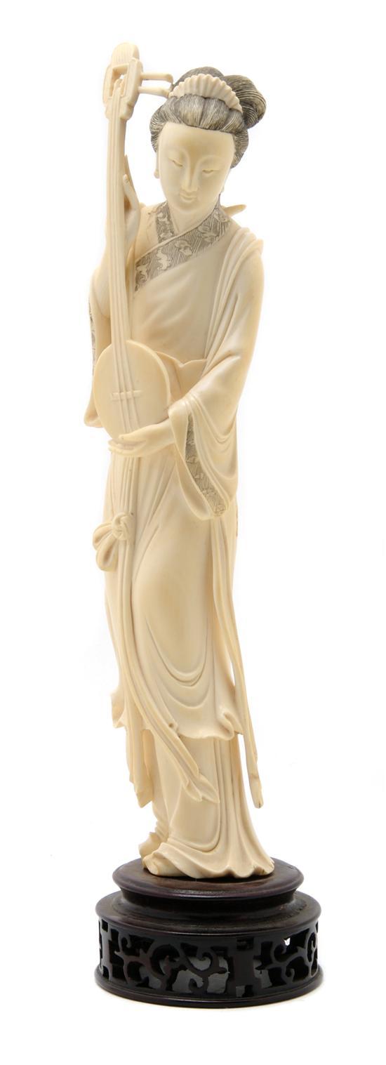 Appraisal: Carved Ivory Figure of a Lady shown playing a stringed