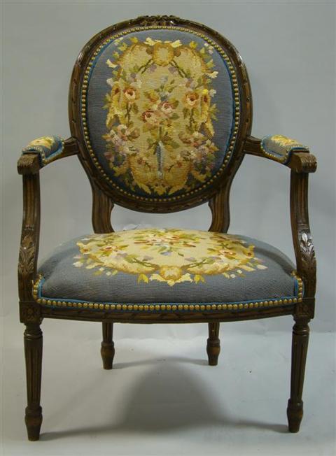 Appraisal: LOUIS XVI STYLE NEEDLE POINT FAUTEUIL the circular back with