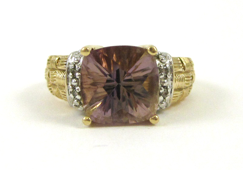 Appraisal: AMETHYST DIAMOND AND FOURTEEN KARAT GOLD RING featuring a cushion