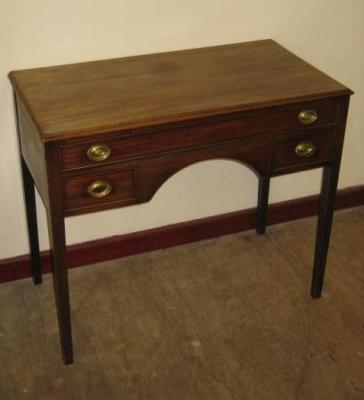 Appraisal: A MAHOGANY WRITING TABLE of oblong form with stringing moulded