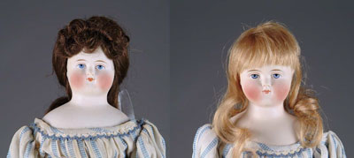 Appraisal: MATCHED PAIR OF CLOSE-MOUTH BISQUE DOLLS A delightful pair of