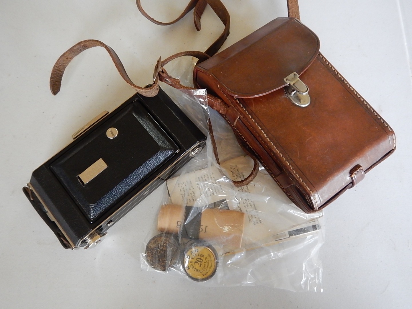 Appraisal: A Kodak folding camera in a leather case