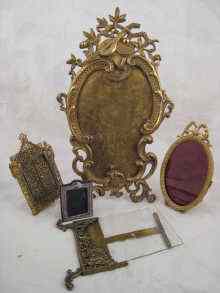 Appraisal: Four various brass picture frames together with a small silver