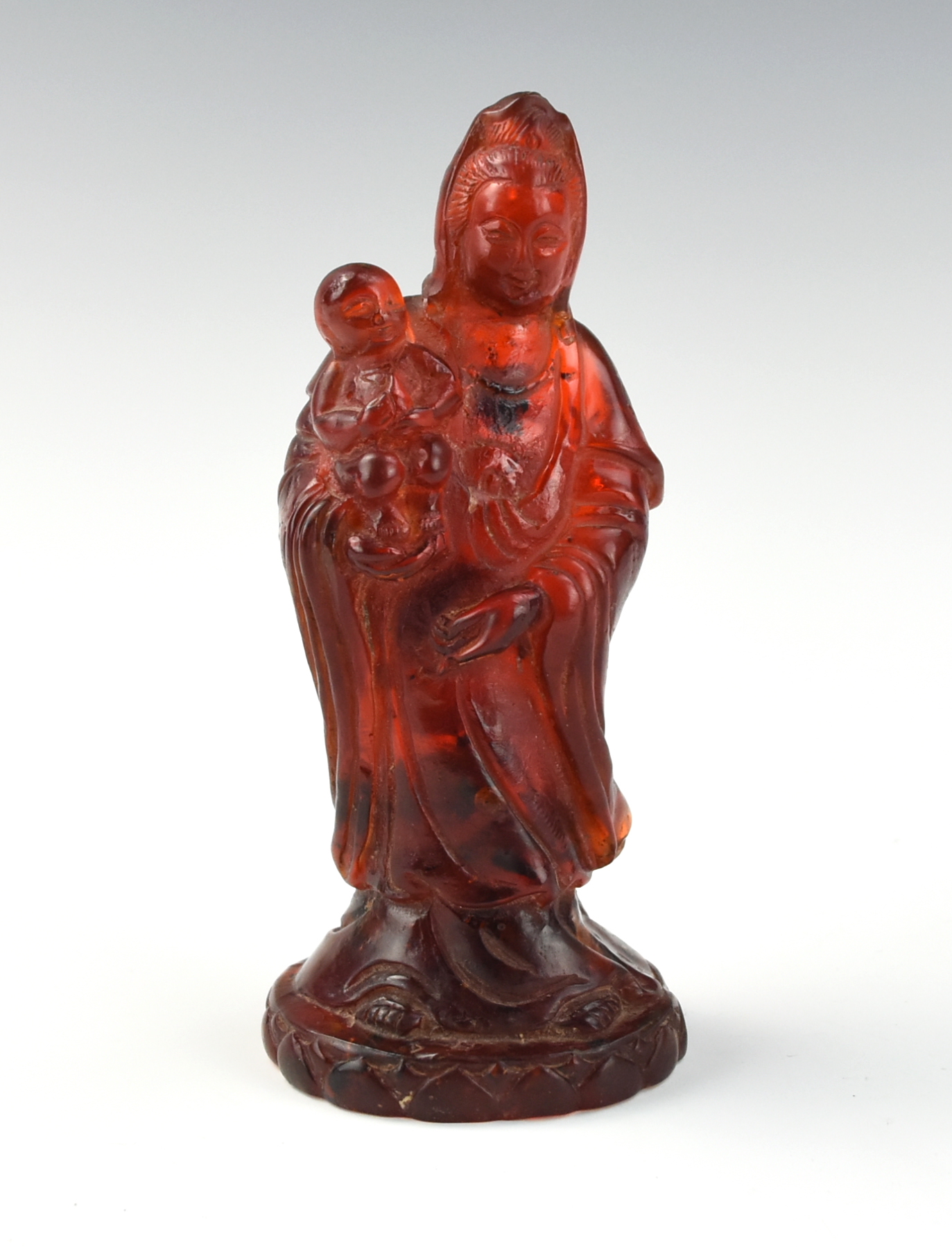 Appraisal: CHINESE ANTIQUE AMBER GUANYIN STATUE Chinese standing with one arm