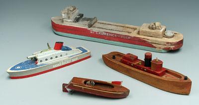 Appraisal: Four wooden toy ships St Lawrence Pulp cargo carrier painted