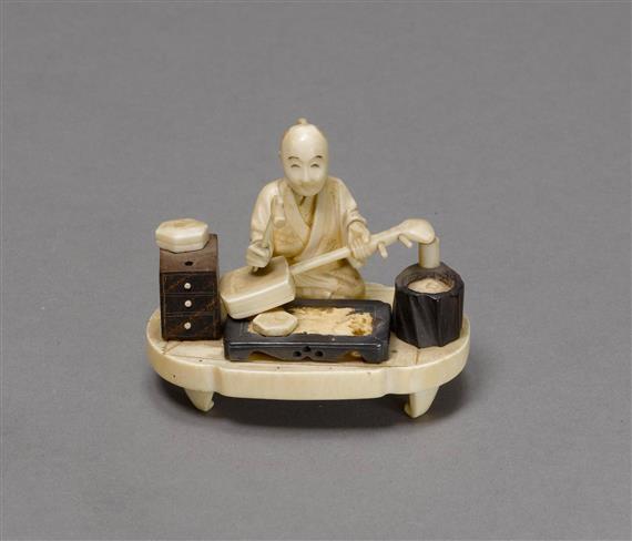 Appraisal: OKIMONO OF A MUSICAL INSTRUMENT MAKER Japan Meiji Period L