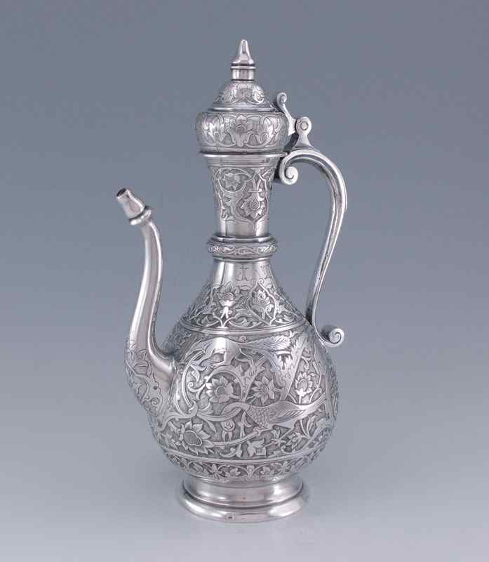 Appraisal: ORNATE AUSTRIAN SILVER EMBOSSED EWER Highly decorative embossed motifs of