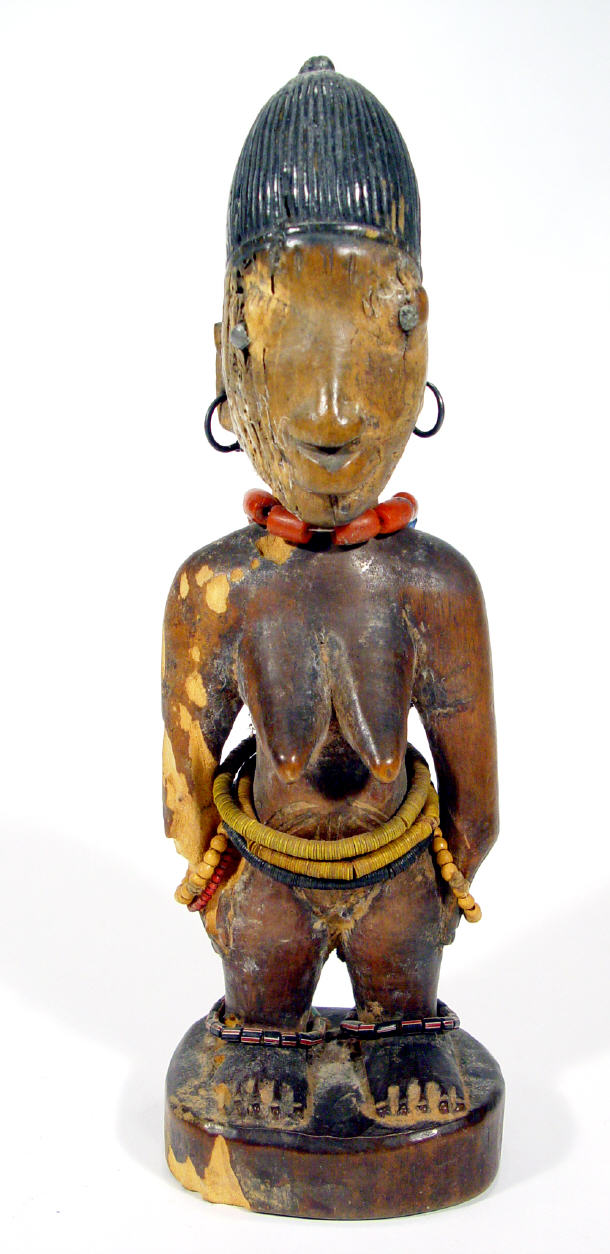 Appraisal: Wooden tribal figure of a female with beaded decoration around