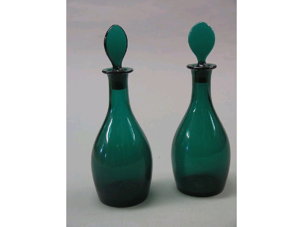 Appraisal: A pair of early th century emerald-green decanters pear-shape with