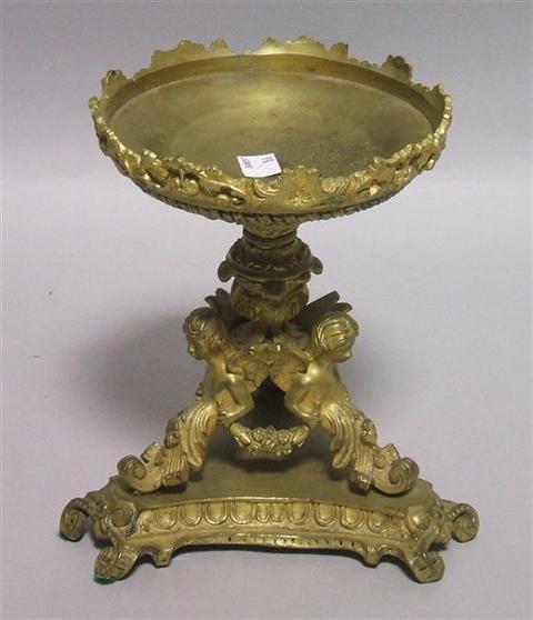 Appraisal: GILT-BRONZE CENTERPIECE Set atop a tri-partite base topped by a