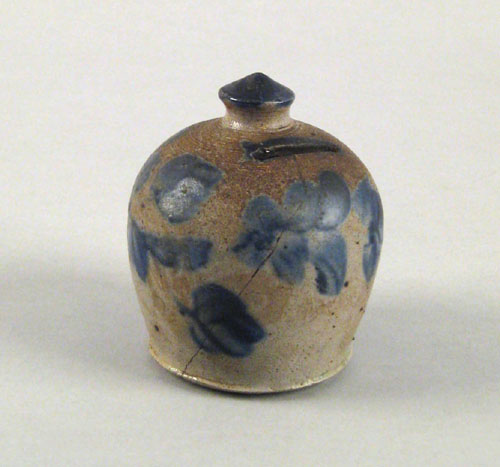 Appraisal: Stoneware bank th c with cobalt floral decoration h