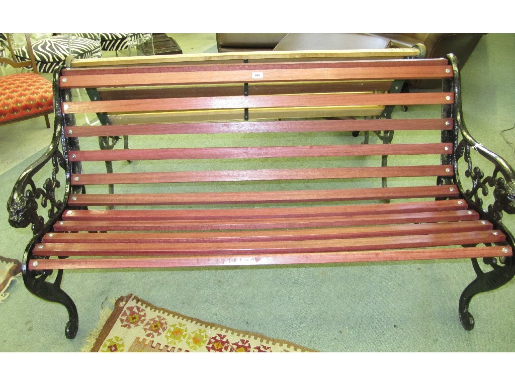 Appraisal: Painted cast iron garden bench with purple heart wood slats