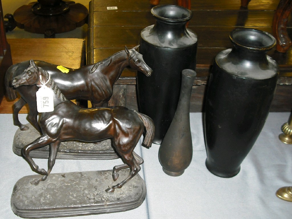 Appraisal: Pair of bronzed spelter figures of horses upon oblong bases