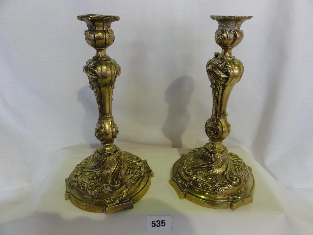 Appraisal: A pair of brass candlesticks in the French style with