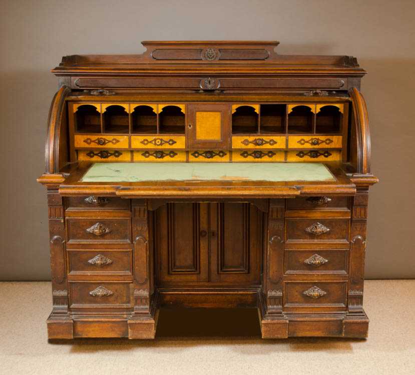 Appraisal: A VICTORIAN WALNUT CYLINDER-ROLL DESK American third quarter of the