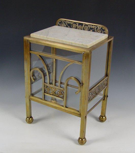 Appraisal: ART DECO BRASS AND GLASS STAND Marble top over glass