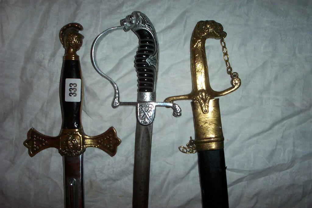 Appraisal: Three th century decorative swords with lion mounts and other