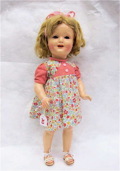 Appraisal: SHIRLEY TEMPLE DOLL composition socket head with blond curly wig