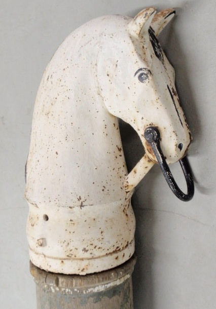 Appraisal: Cast iron horse head and wood hitching post head h