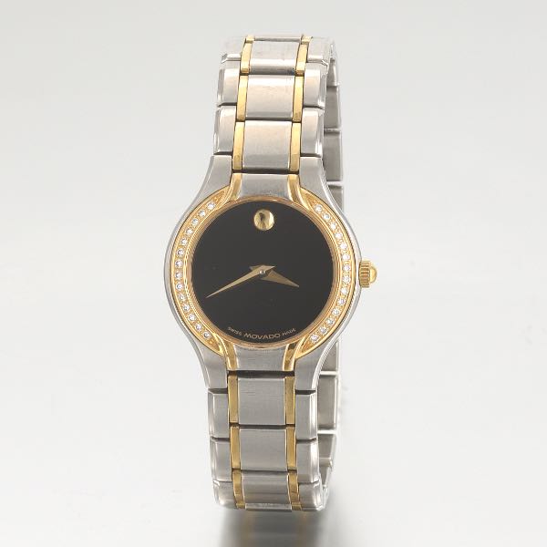 Appraisal: MOVADO K GOLD AND STAINLESS WATCH AND BRACELET DIAMOND BEZEL