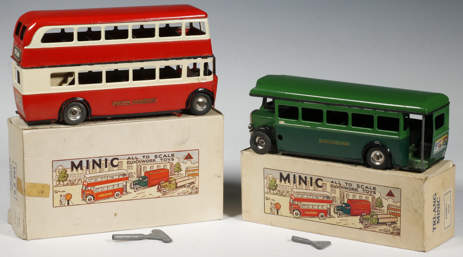 Appraisal: VINTAGE TRI-ANG MINIC BUSES Lot of British Made Tri-ang Minic