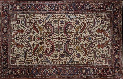 Appraisal: HERIZ RUG NORTHWEST PERSIA The ivory ground with geometric overlay